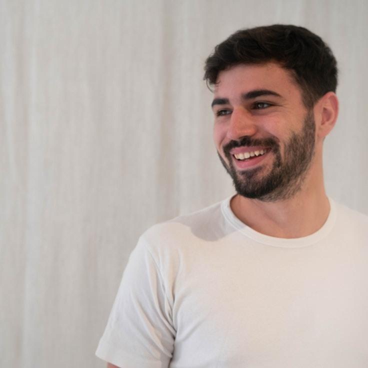 Kaveri Mehta, Lead Design Curator at Sphere Copper Fresh, reviewing corporate floral arrangements